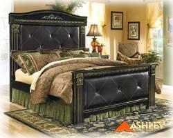 B175 Coal Creek Replicated rich dark brown finish with replicated subtle brush marks Mansion bed with upholstered faux leather panels and jumbo stitching Deeply carved egg and dart