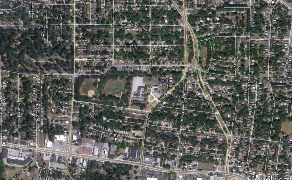 The aerial photograph below illustrates the residential neighborhood setting of the park. Homes are generally single family brick structures, with drives and garages.