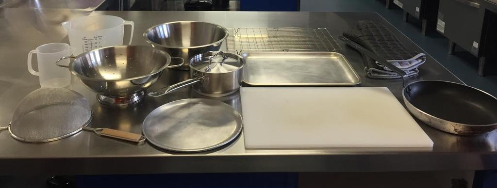 Colander Mixing bowl Small saucepan and lid Cooling rack Oven gloves Measuring jugs Baking tray Sieve Small pizza tray Chopping board Small non stick frypan Additional items are located on the open