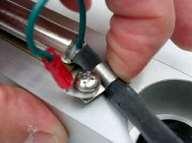 Secure the ground wire and the cable using the Phillips screw and captive washer with cable