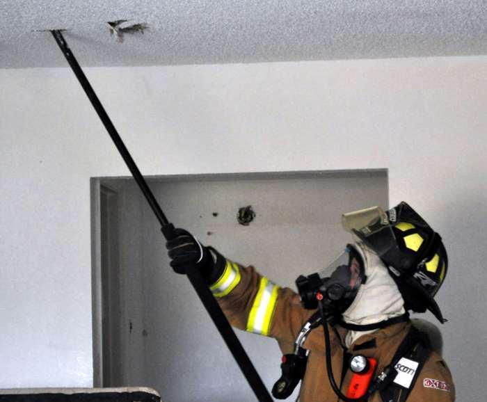 FIRE ATTACK PULL CEILING Make small access hole to keep fire ventilation limited.