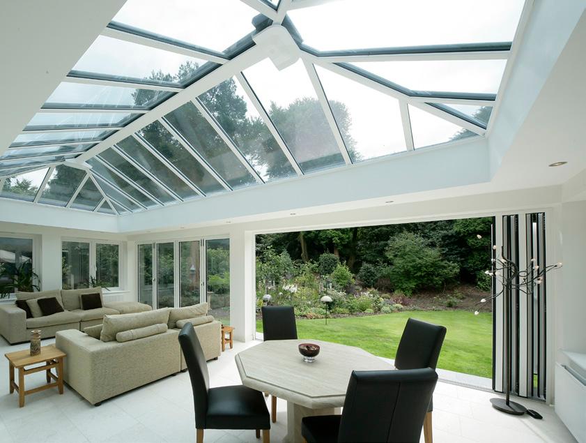 light filled extension to a property with large roof lanterns and tall
