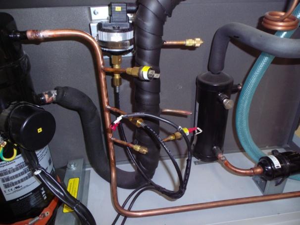 9) Replace a new one in the unit, fastened the 4 screws first, take on the compressor heating belt, then, using the welding torch to connect the copper tubes with compressor inlet and outlet.