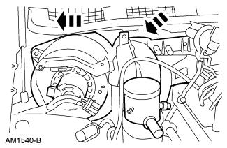 23. Remove the in-car temperature sensor hose and elbow from the evaporator housing (if equipped). 24. Remove the evaporator housing.