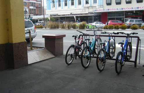 There is a lack of cycle racks on reet, particularly in front of the SIT building. Currently bicycles are parked against street light poles and raised grass plinths.