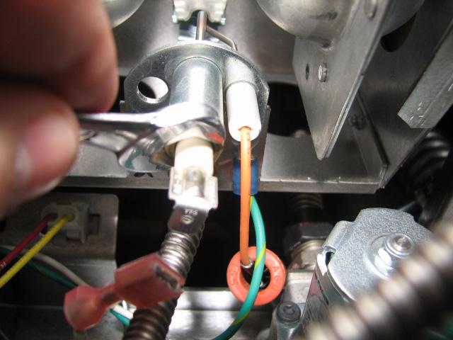 Using a 7/16 wrench, loosen the pilot tube from the pilot. 8.