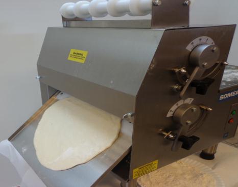 setting of the rollers, which means your roller adjustment has to be opened more, or the dough is too cold and stiff and requires a longer