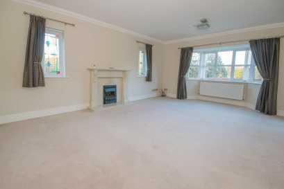 Feature marble fireplace and surround with hearth and coal effect gas fire, tv and telephone points and two double panelled radiator. FAMILY ROOM 4.14m x 3.