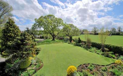 Set within grounds approaching ¾ of an acre, commanding breath-taking rural views and