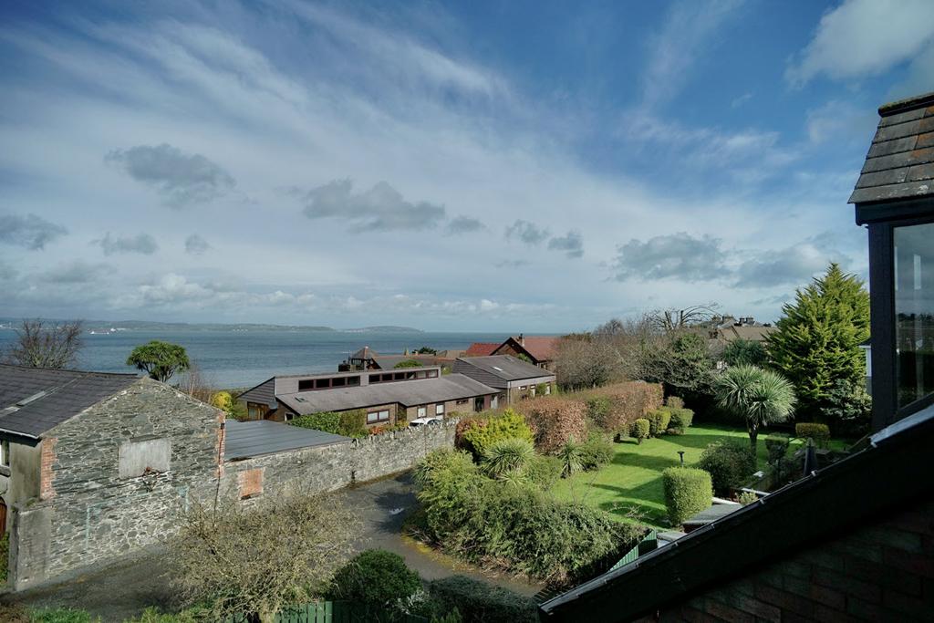 SUPERB PANORAMIC LOUGH VIEWS This deceptively spacious detached individually designed home provides excellent family