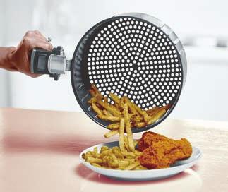 Place the assembled Outer Basket and Fry Basket on a heat-resistant surface. 2. Move Sliding Button Guard forward to expose Basket Release Button. 3.