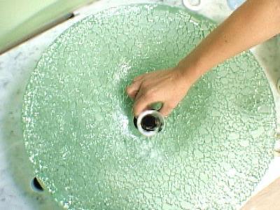 of cutting holes for the sink and faucet assembly Step 2: Apply Putty to the Underside Roll out a bead of