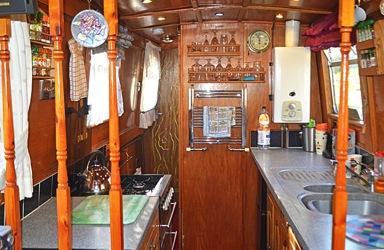 GALLEY 6 10 The walk through galley has custom built units with oak door and drawer fronts.