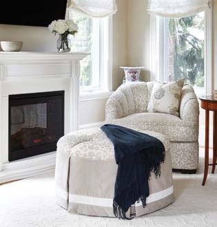 A small sitting area by the fireplace was created in an otherwise underutilized space in the bedroom.