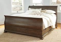 Wing bed features textured weave oatmeal toned fabric Sleigh bed has robust serpentine posts and tall 35 footboard Drawers offer ball bearing side glides, French