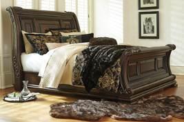 metallic detailing Bedroom adorned with ornate details, grand scale, and natural marble tops Gracious curving sleigh bed is centerpiece of this outstanding group Night stand has easy access AC power