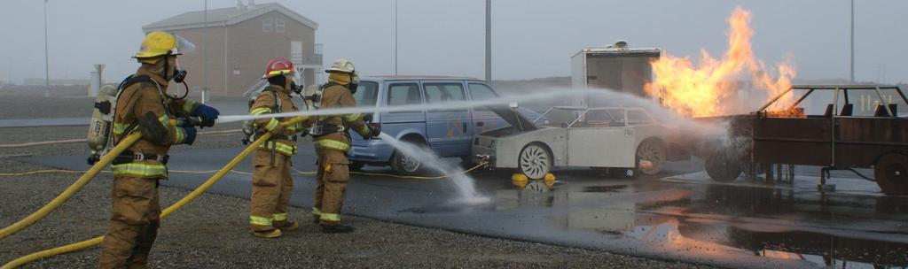 Figure 2. Team of fire fighters responding to a simulated multi-vehicle accident involving a hydrogen FCV (middle) and conventional vehicles.