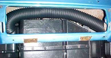 Cut 27 of flex hose and attach to outlet on top of the