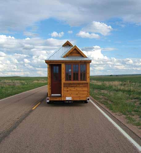 The WEEBEE is based on the EPU design with the addition of a Dutch hip roof and fold out bed in the bump-out downstairs. This little house comes on integral wheels.