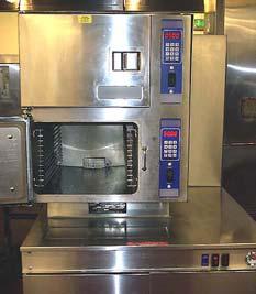 hotel banquet kitchen with a floor-mounted, 2-compartment, 6-pan, boiler-based gas steamer.