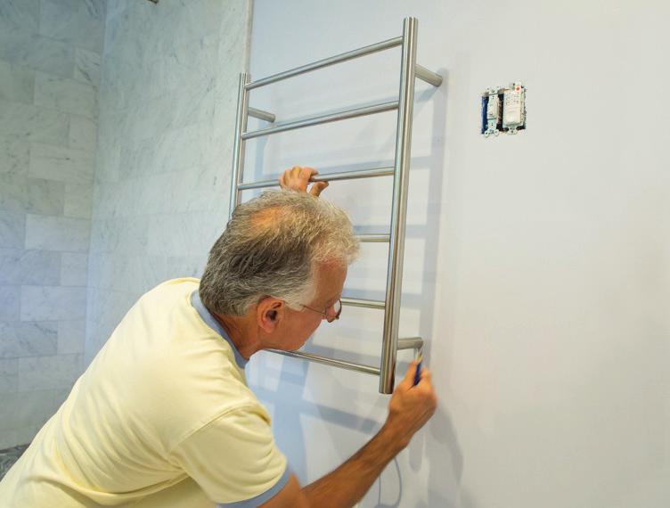 MOUNTING YOUR TOWEL WARMER Do note that all models will have the power cord exiting on the bottom right bracket (when facing the towel warmer mounted on the wall).