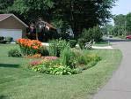 Rain Gardens What is a rain garden? A rain garden is an attractive landscaped area planted with perennial naïve plants which don t mind getting wet feet.