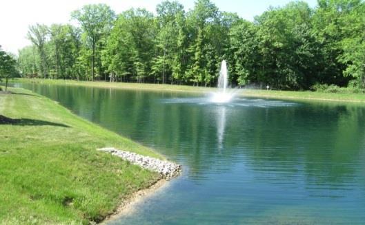 STORMWATER CONTROL MEASURES Wet pond with well maintained, grassed shoreline and stoned inlet into pond.