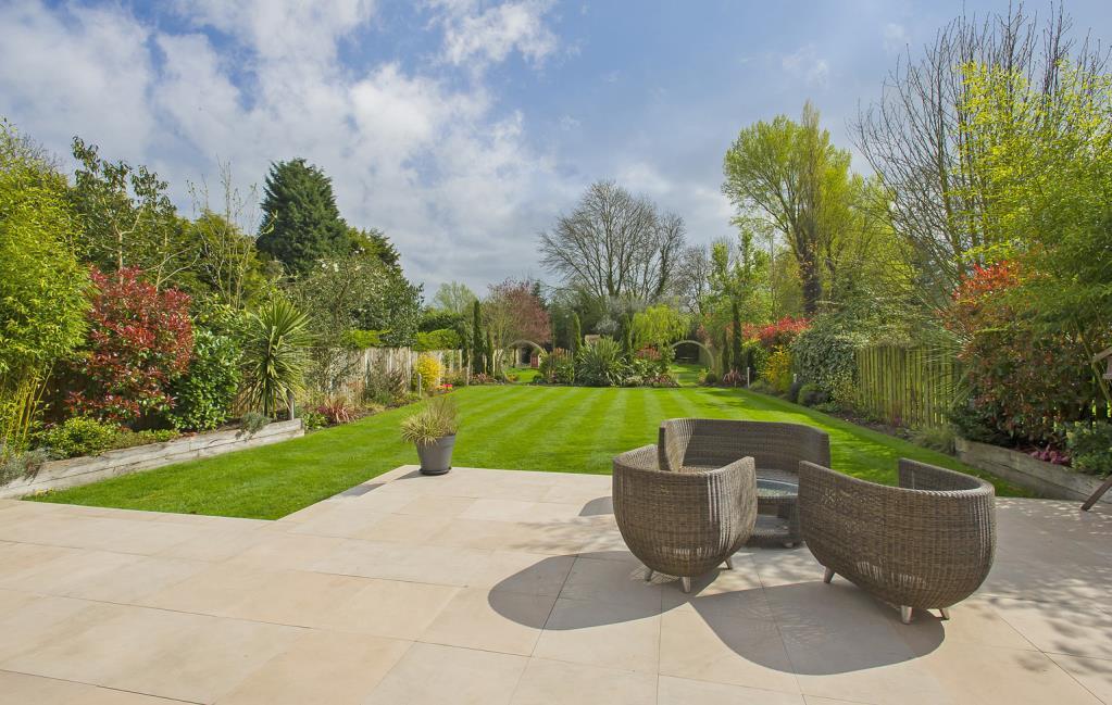 Open plan lawns with shrubbery planting/shrubbery borders and mature cherry tree. The main garden area is set to the south east of the house offering a high degree of privacy.