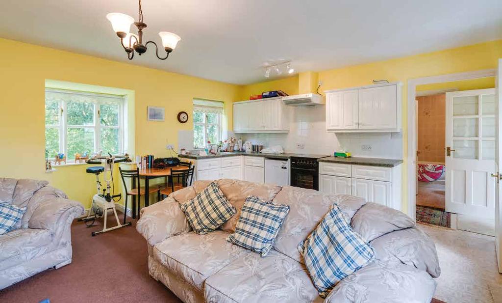 The Annexe has electric storage heating and has a pleasant open plan Living Kitchen. The Living area has an open fire.