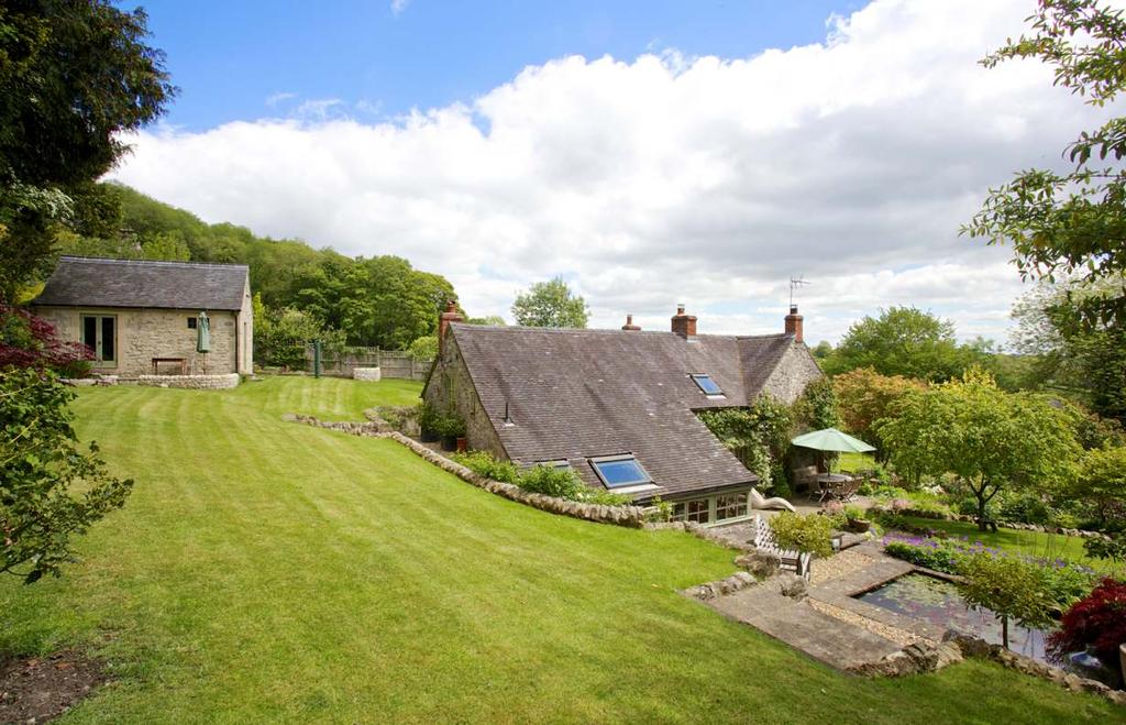 Gardeners Cottage Kiln Lane, Parwich, Ashbourne Derbyshire, DE6 1QB A beautifully presented stone cottage set in picturesque gardens enjoying views over this highly sought-after village within the