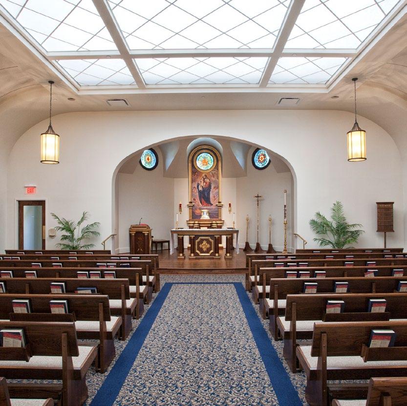 accessible Saint Pius Faith Center Expansion The 100-seat chapel features a skylight-lit nave and round stained glass portals above the