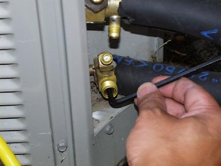With the system running, close the liquid line service valve. 4.