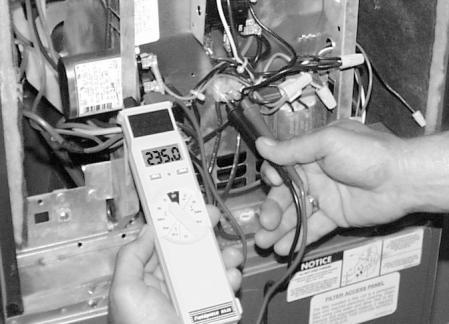Measure the total amperage being drawn by the air handler. (Fig 2) Record the value. 4. Multiply the measured supply voltage by the measured supply amperage. Now multiply your answer by 3.414.