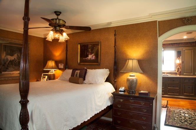 Master bedroom has a built in furniture style cabinet with rounded