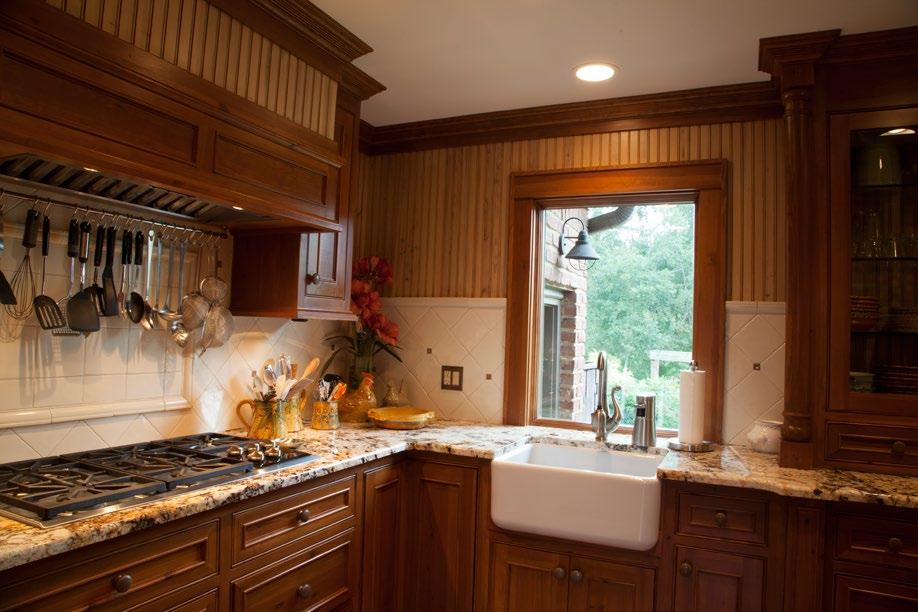 All cabinets in kitchen and laundry room are custom-made knotty pine with Golden Queen