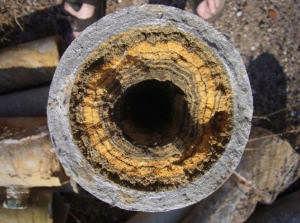 Rust normally forms within metal cooling channels when there is retention (non-flowing) of water for a period of time.