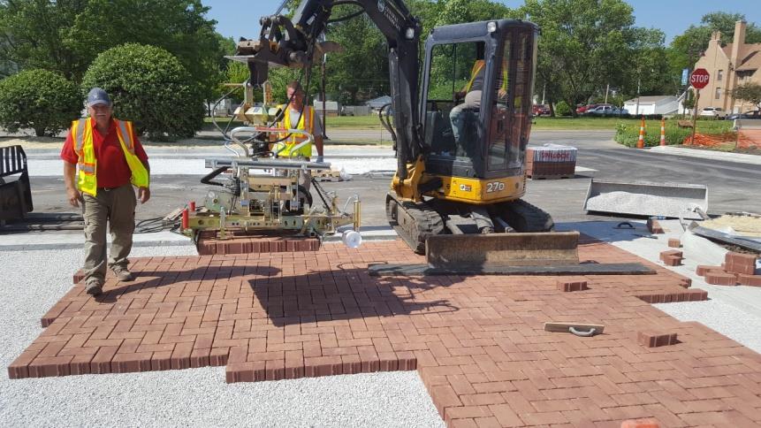 small backhoe and paver