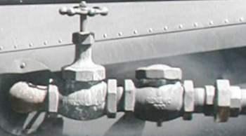This is a close-up on the left side fittings next to the boiler port: elbow - valve - check