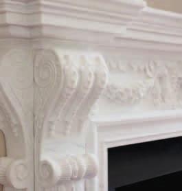 Hand-carved from premium-quality Imperial white marble, the surround is a test of a master stone-carver s skill, featuring as it does a female mask at the centre of the frieze and exquisite detailing