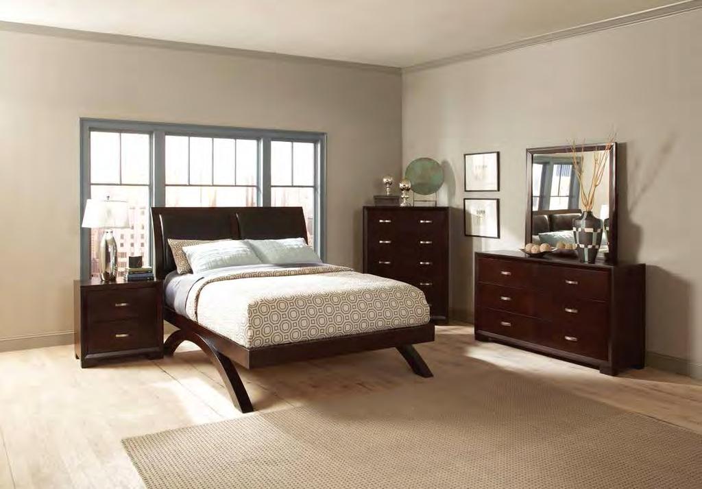 Creating a focal design point are the finger pulls that replace the need for hardware on the sleekly designed case pieces a design feature that carry onto the panel headboard.