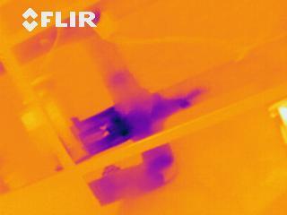 In Figure 6, another HVAC ceiling unit had moisture trapped between the insulation jacket and the unit piping.