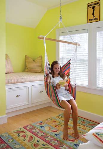 The family enjoys the outdoor decks overlooking the marsh. Below: The girls bedroom is decorated in vibrant colors.