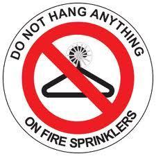 Tampering with and/or blocking the Sprinkler System: Items such as clothes hangers, decorations, etc., must not be placed on the sprinkler heads and related piping.