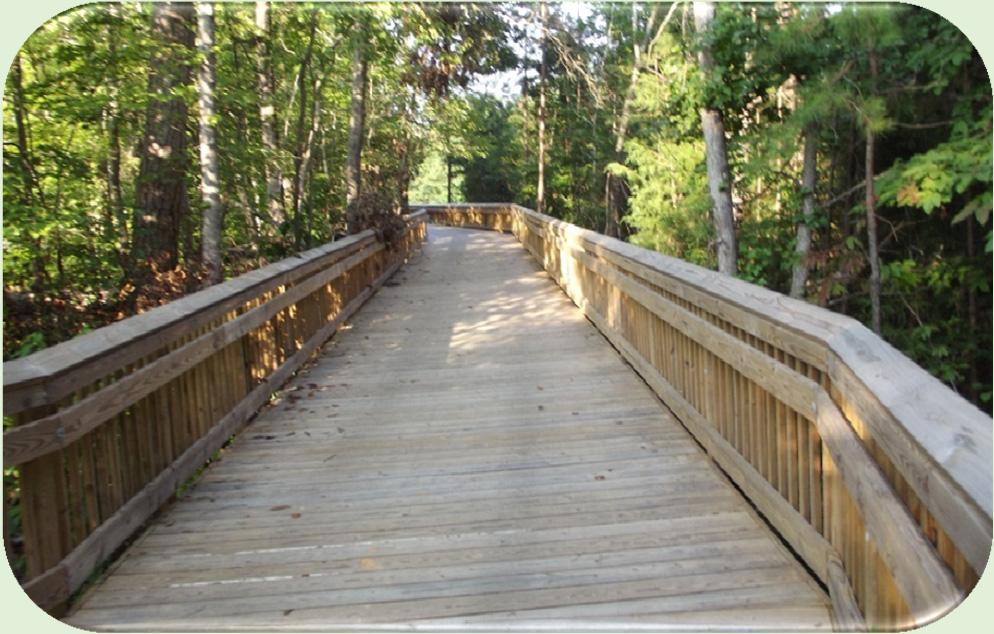 Cost: $250-$400 per LF Wood Boardwalk w/ Rails 4 Mile Creek Greenway, Matthews 10-12 clear width, 100 PSF to