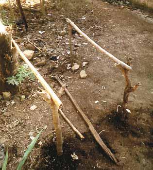 How to make Dig in 4 stakes at the corners of a square, and between 50cm and 1