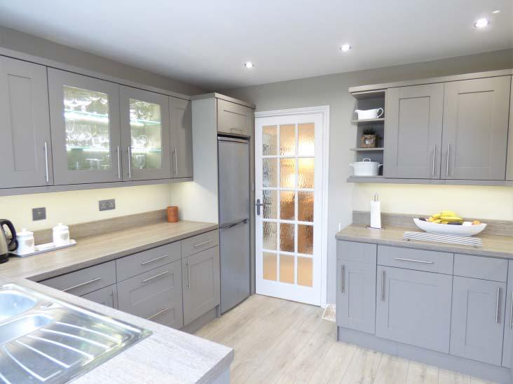 Kitchen 11 3 x 9 8 approx. A modern and refitted kitchen with a large double glazed window to the rear and part double glazed door leading out to the rear.
