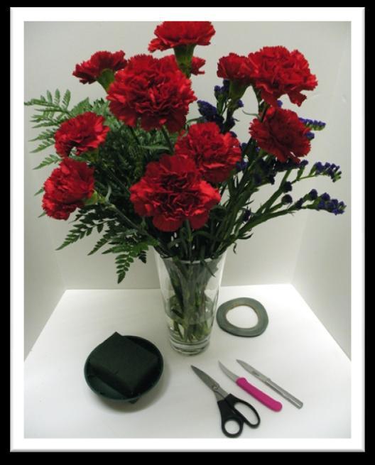 Symmetrical Triangle Arrangement 9 stems of carnations provided 10 stems of leather provided 7-10 florets of statice approximately 3 stems provided There will be no extra product provided.