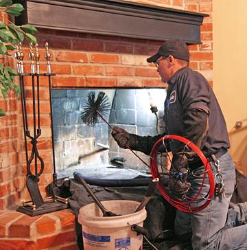 Routine Maintenance Wood Fireplace Routine maintenance of removing ashes and cleaning up debris around the fireplace.