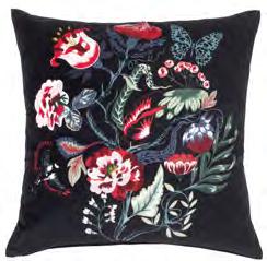 90 SARALENA cushion has one side with a floral pattern and the other with a contrasting red colour for variety.