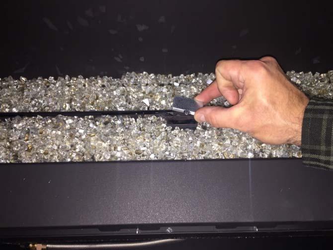 end air channels are free of crushed glass. Use a screwdriver to clear this area.